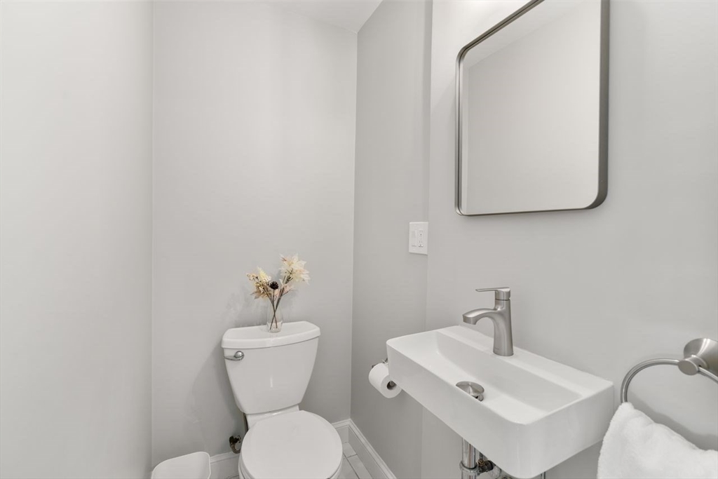 11 Winter Street Foxboro, MA 02035 - Photo 21 of 34 a bathroom with a toilet sink and mirror