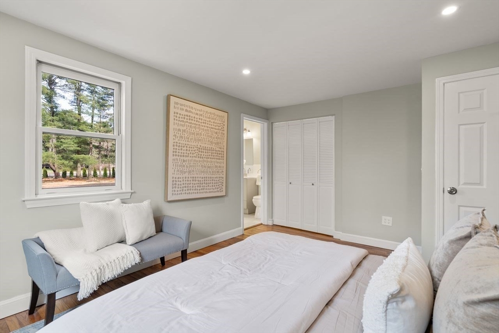 11 Winter Street Foxboro, MA 02035 - Photo 23 of 34 a spacious bedroom with a bed and a couch