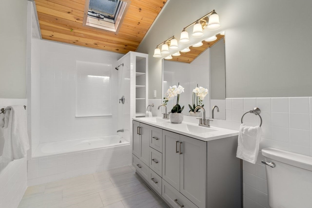 11 Winter Street Foxboro, MA 02035 - Photo 24 of 34 a bathroom with a double vanity sink mirror and shower