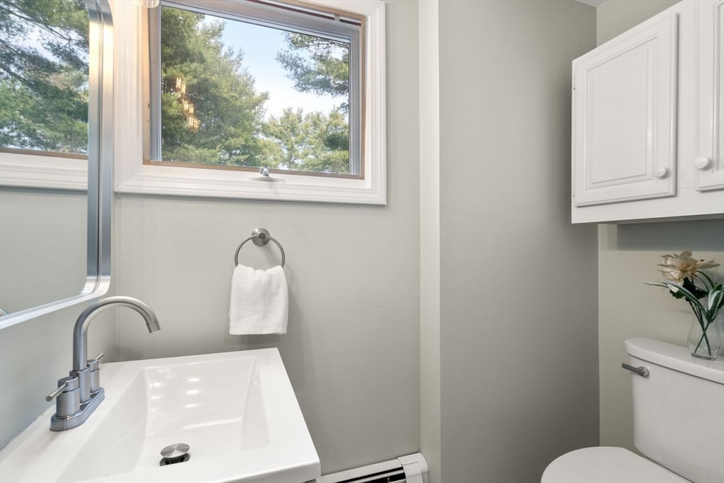 11 Winter Street Foxboro, MA 02035 - Photo 28 of 34 a bathroom with a sink mirror and toilet