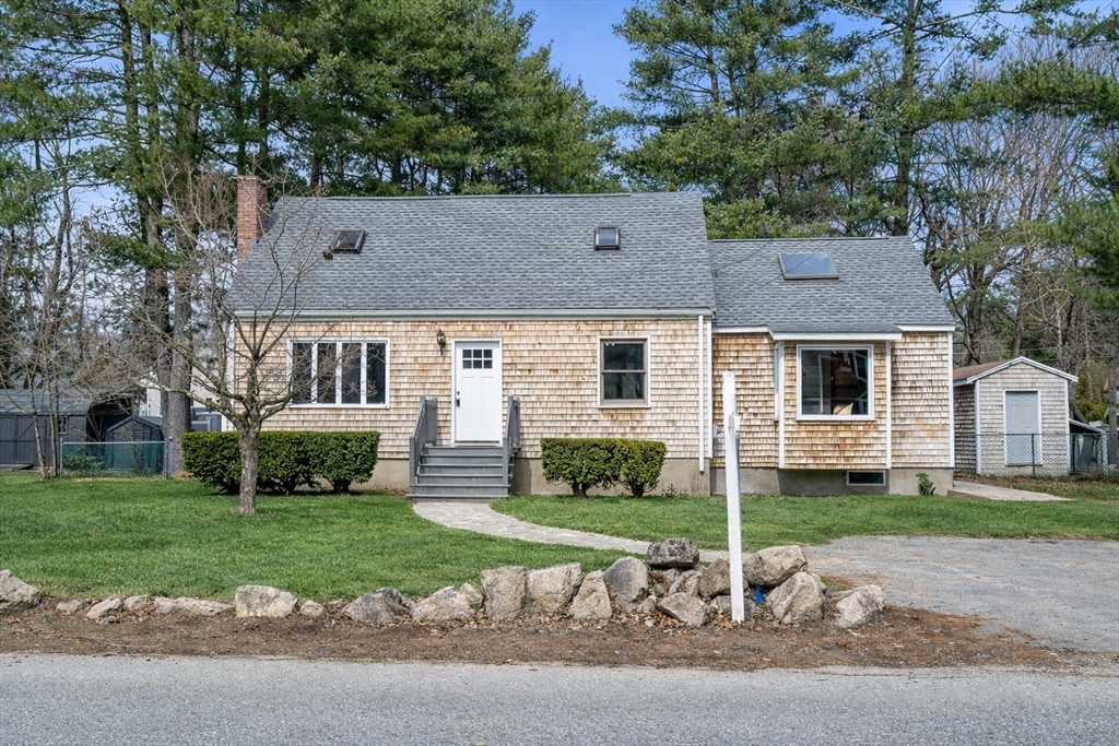 11 Winter Street Foxboro, MA 02035 - Photo 30 of 34 a front view of a house with a yard and garage