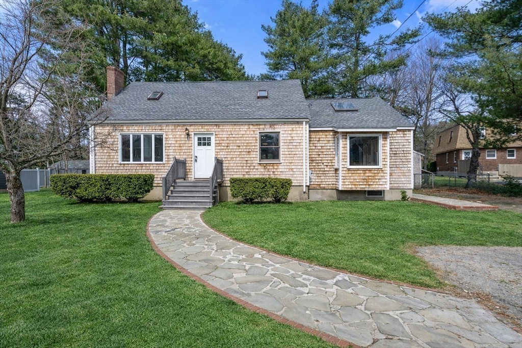 11 Winter Street Foxboro, MA 02035 - Photo 3 of 34 a front view of a house with a garden and yard