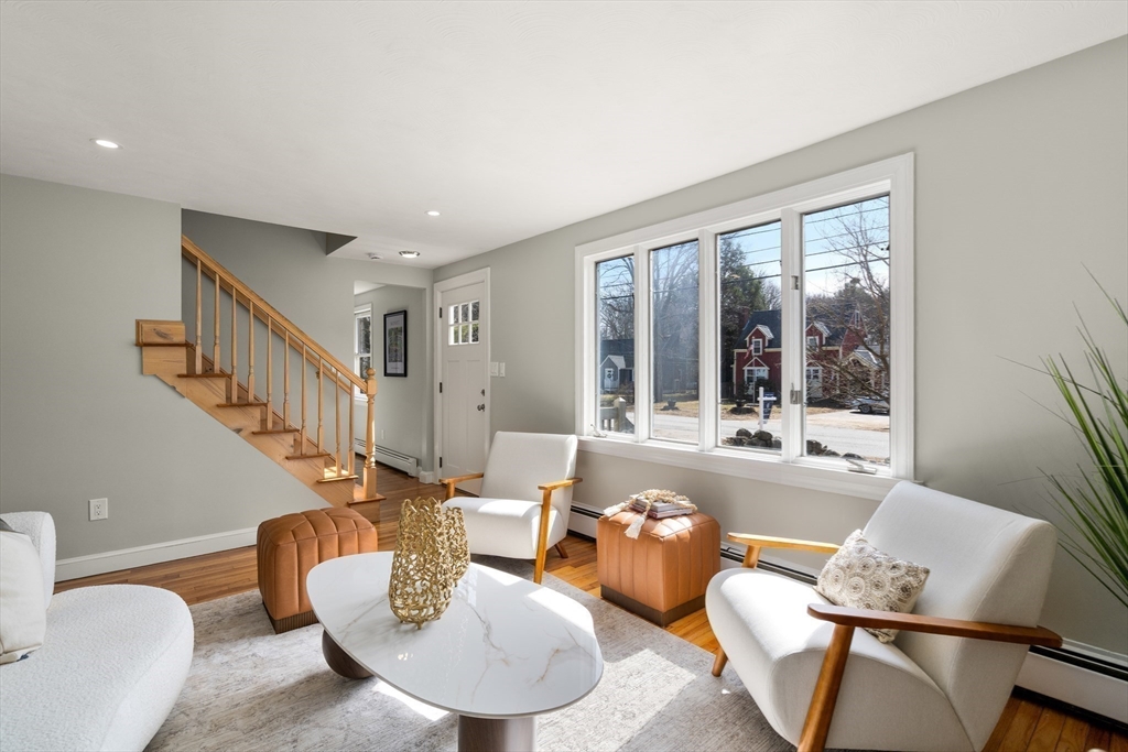 11 Winter Street Foxboro, MA 02035 - Photo 4 of 34 a living room with furniture and a large window