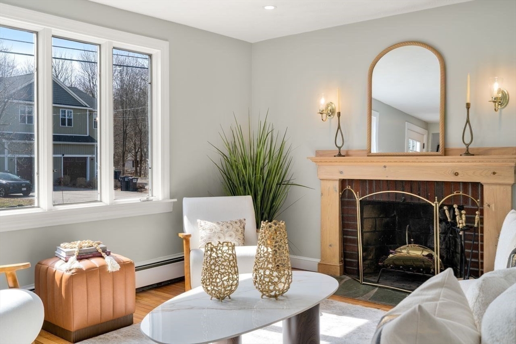 11 Winter Street Foxboro, MA 02035 - Photo 5 of 34 a living room with furniture and a fireplace