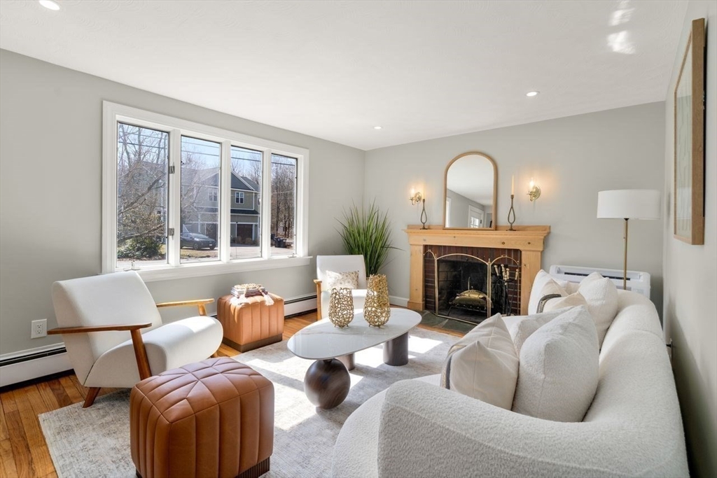 11 Winter Street Foxboro, MA 02035 - Photo 6 of 34 a living room with furniture and a fireplace
