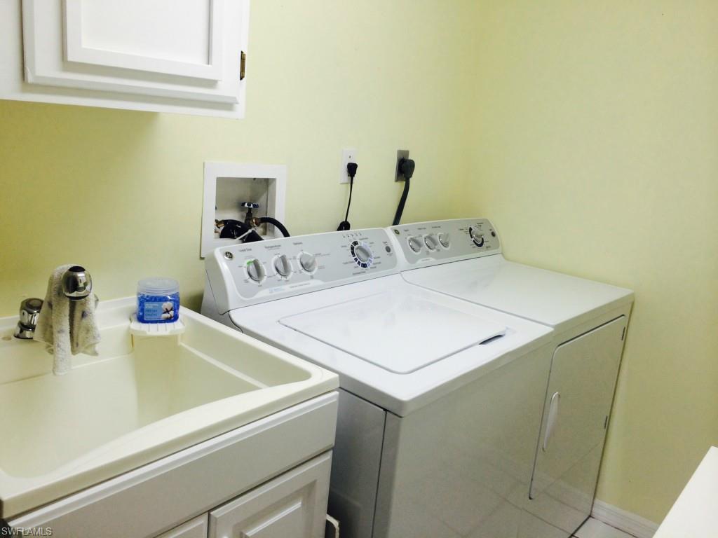 717 Landover Circle, Unit 103 Naples, FL 34104 - Photo 18 of 18 Laundry room in residence