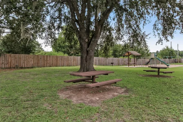a swimming pool with wooden fence