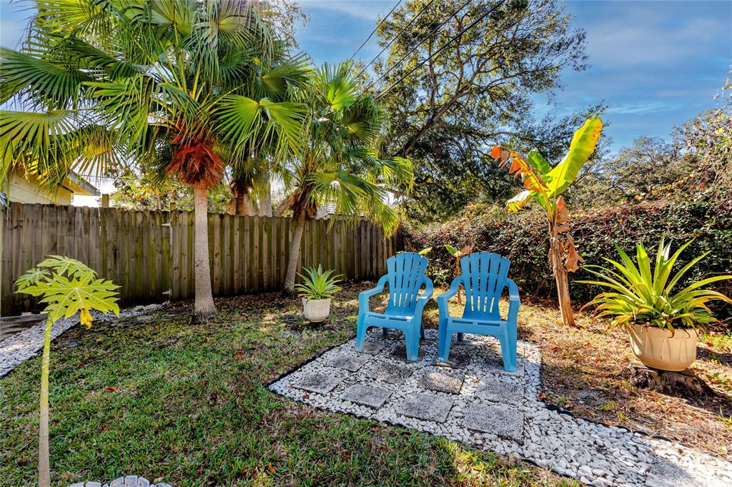 5596 100th Way North St. Petersburg, FL 33708 - Photo 44 of 67 a backyard of a house with lots of green space