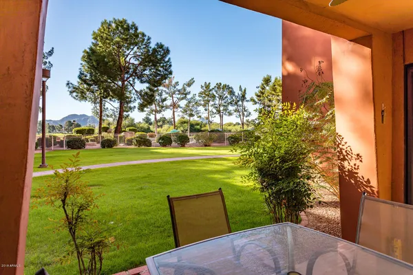 a view of a big yard with a fountain