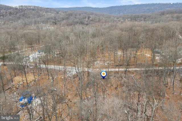 a view of a lake with a house in the background