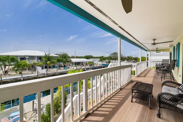 a view of a lake with couches and city view
