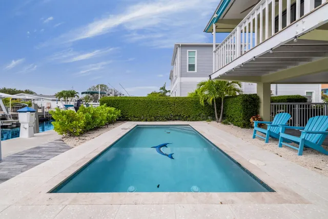 a view of a work space with furniture window and wooden floor