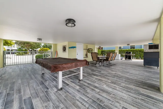 a view of a livingroom with furniture wooden floor and window