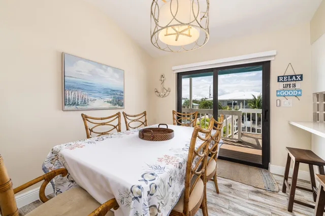 a bed room with a bed a television and a window