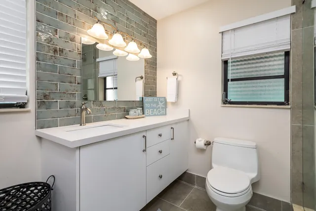 a picture of a room with a white wall and a large picture of a white wall