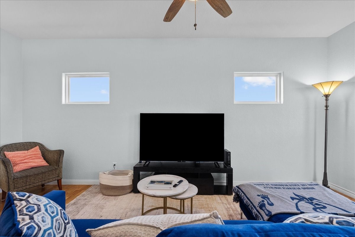 1012D 22nd Street, Unit D Dickinson, TX 77539 - Photo 12 of 44 a living room with furniture and a flat screen tv