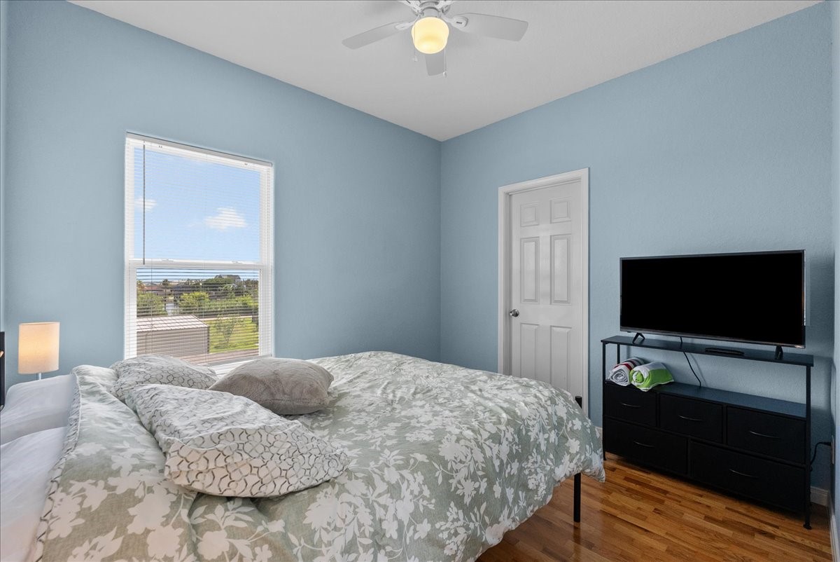 1012D 22nd Street, Unit D Dickinson, TX 77539 - Photo 27 of 44 a bedroom with a bed and a flat screen tv