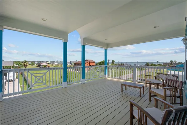 a view of roof deck with furniture