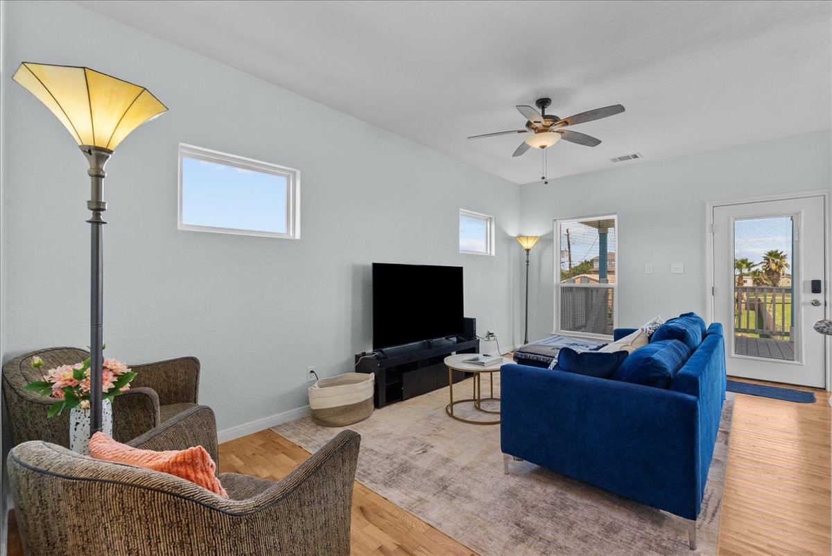 1012D 22nd Street, Unit D Dickinson, TX 77539 - Photo 9 of 44 a living room with furniture and a flat screen tv