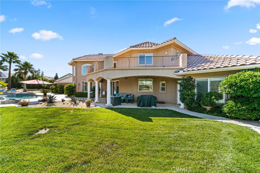 38136 Butterfly Court Yucaipa, CA 92399 - Photo 18 of 71 a view of a house with a swimming pool