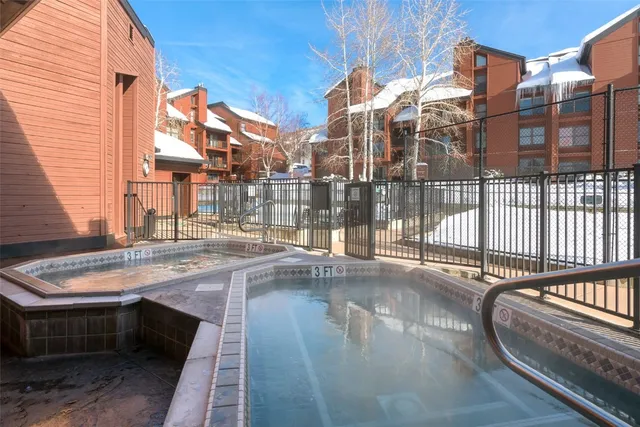 a view of lobby with a door and wooden floor