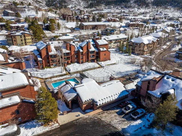 an aerial view of residential houses with outdoor space