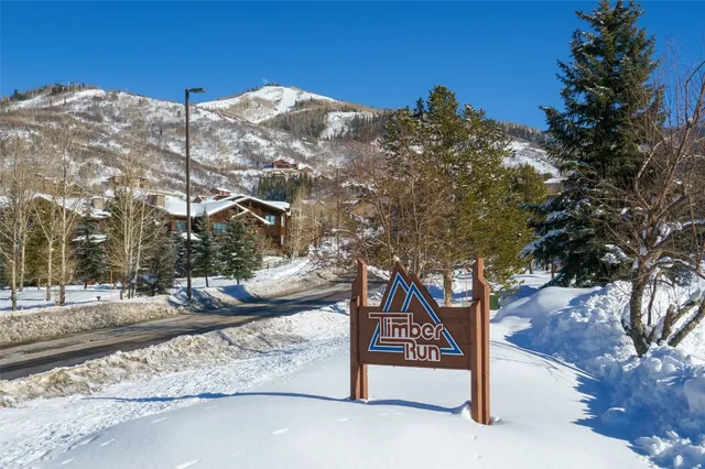 a view of a street with a building in the background