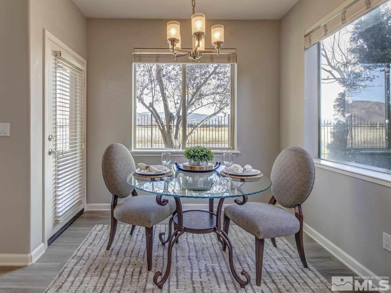 900 South, Unit 3714 Reno, NV 89521 - Photo 1 of 23 a dining room with furniture a window and wooden floor
