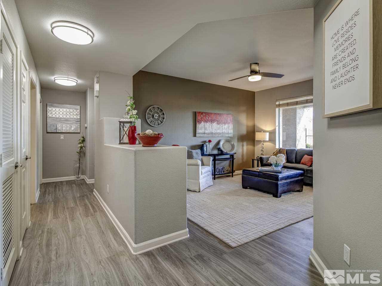 900 South, Unit 3714 Reno, NV 89521 - Photo 3 of 23 a living room with furniture and a wooden floor