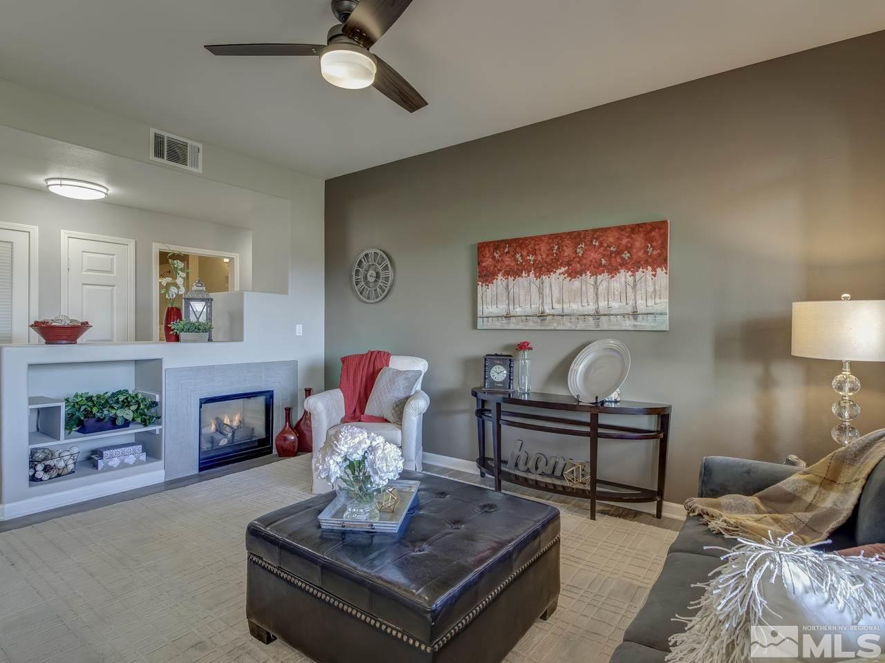900 South, Unit 3714 Reno, NV 89521 - Photo 4 of 23 a living room with furniture and a fireplace