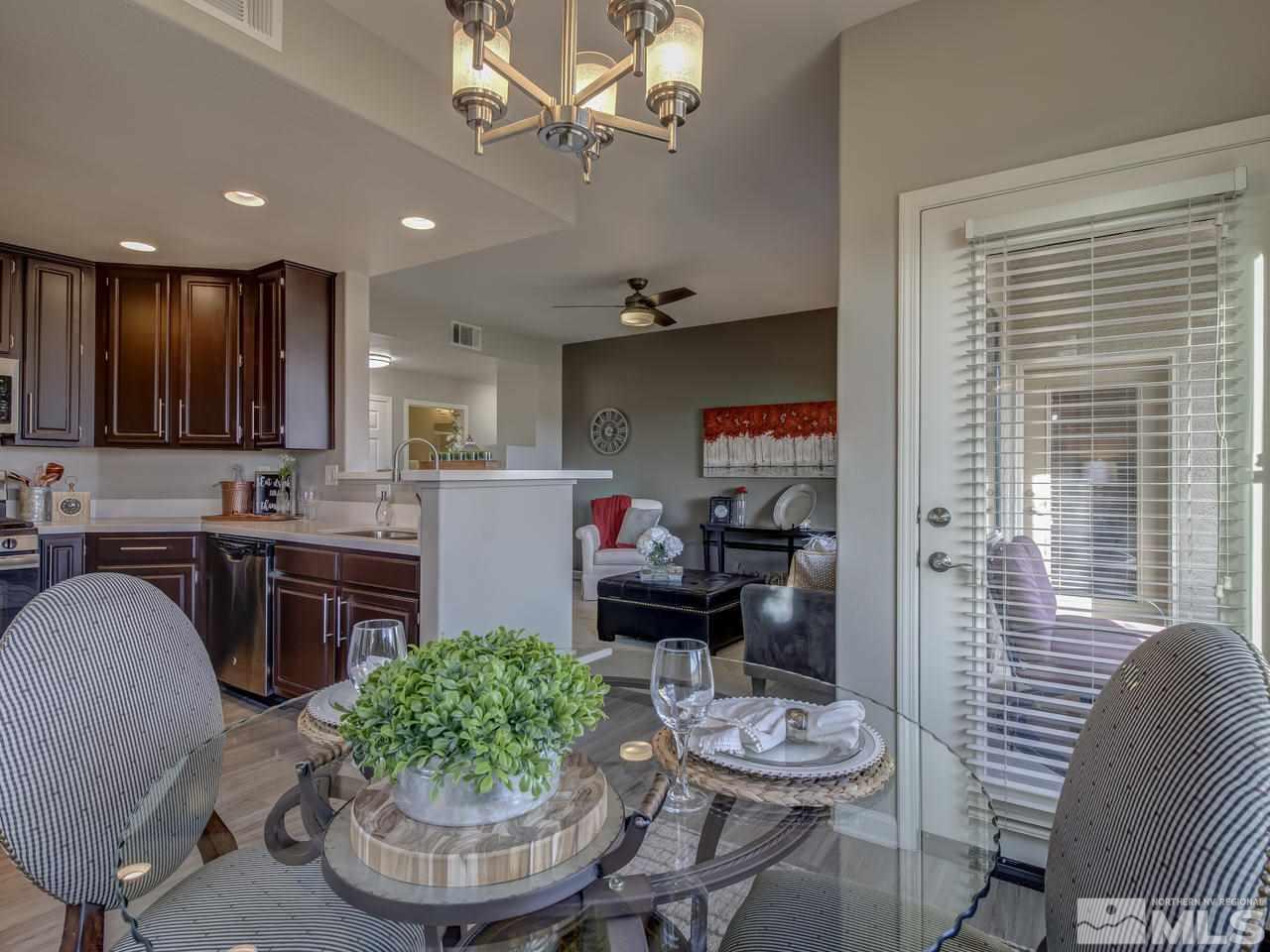 900 South, Unit 3714 Reno, NV 89521 - Photo 6 of 23 a kitchen with a table and chairs in it