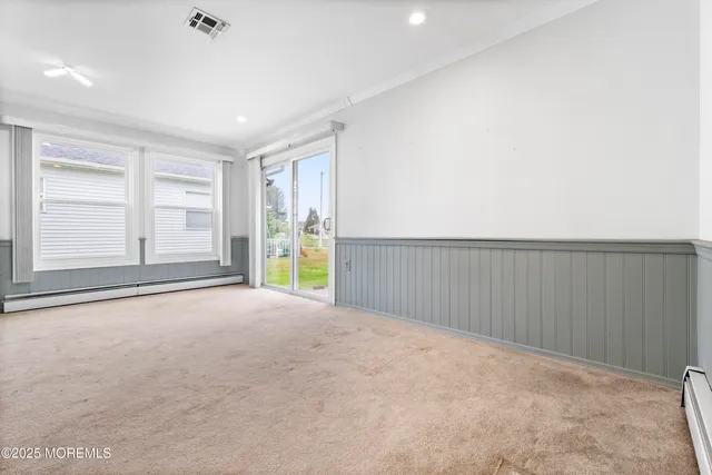 an empty room with an empty space and wooden floor