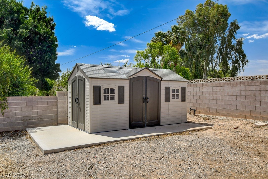 4362 Thistle Street Logandale, NV 89021 - Photo 91 of 99 Storage shed with ample space, offering practical utility for outdoor essentials.