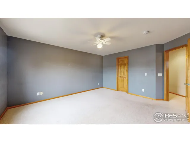 a open hall with a ceiling fan