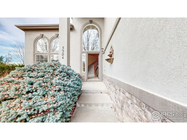 a house view with a swimming pool