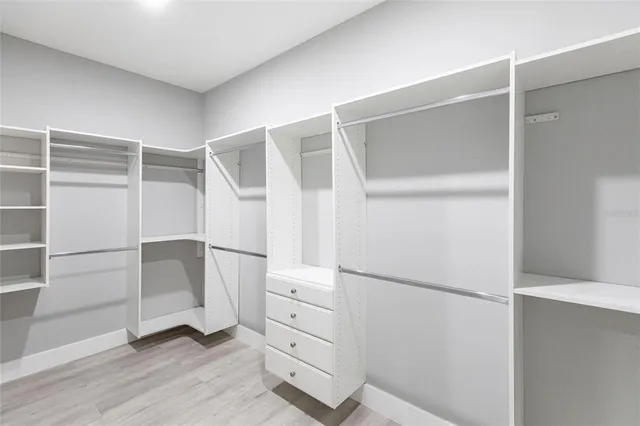 a view of an empty walk in closet
