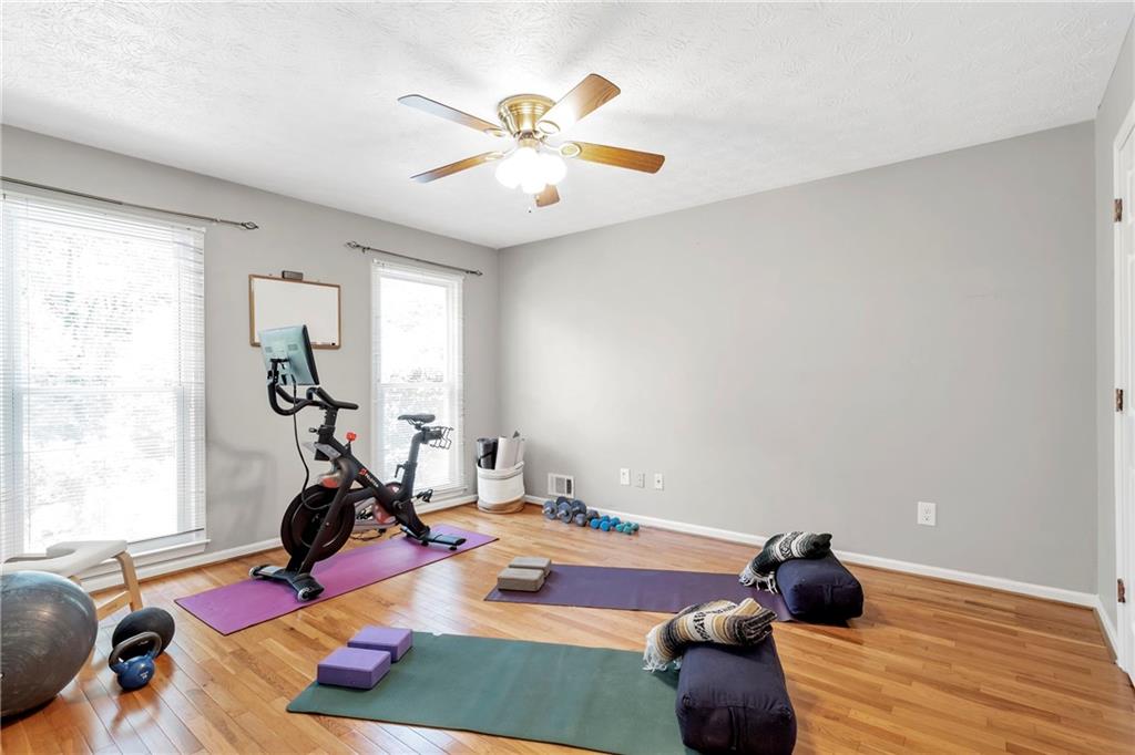 3167 Northbrook Drive Atlanta, GA 30341 - Photo 26 of 53 a room with gym equipment and view of living room