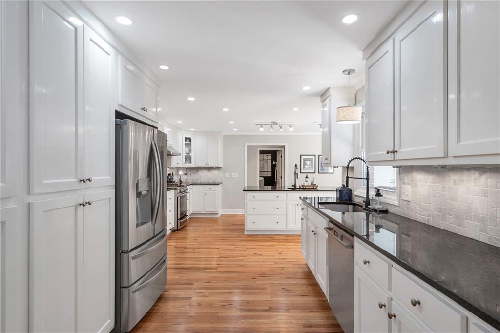 3167 Northbrook Drive Atlanta, GA 30341 - Photo 4 of 53 a large kitchen with stainless steel appliances lots of counter space and a sink