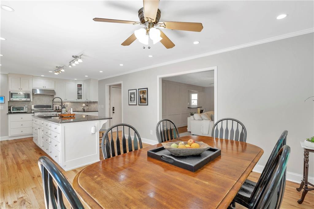 3167 Northbrook Drive Atlanta, GA 30341 - Photo 7 of 53 a kitchen with a table chairs and a dining table