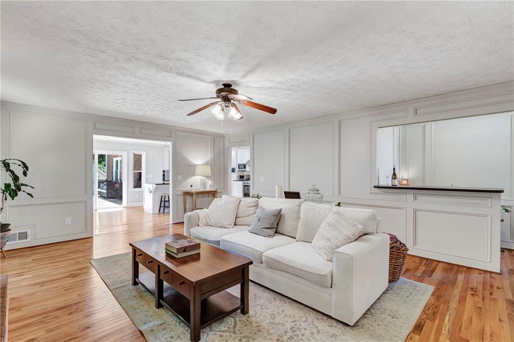 3167 Northbrook Drive Atlanta, GA 30341 - Photo 10 of 53 a living room with furniture and a wooden floor