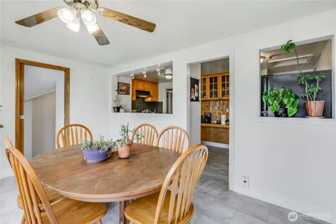a dining room with furniture and window