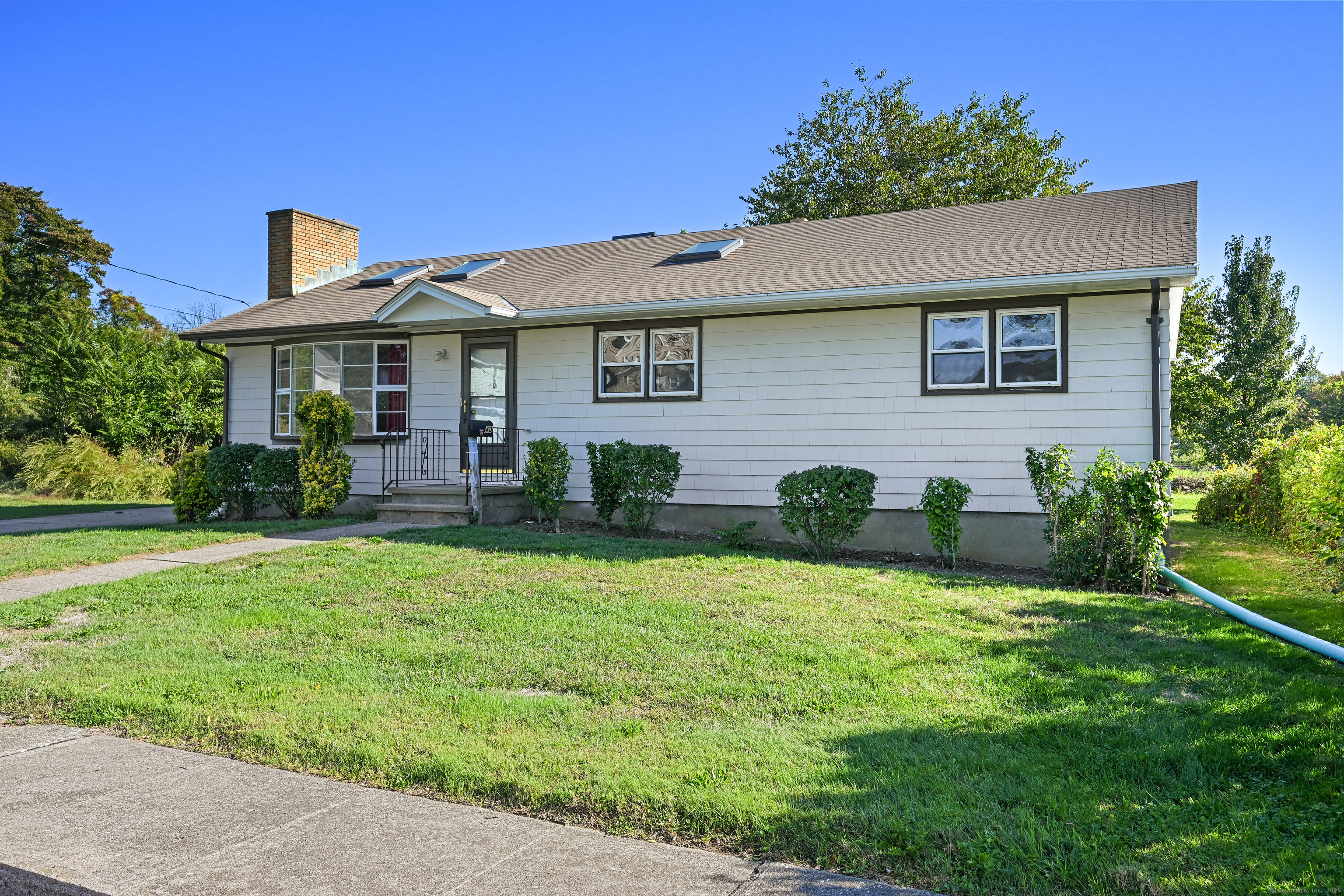 a front view of a house with a yard