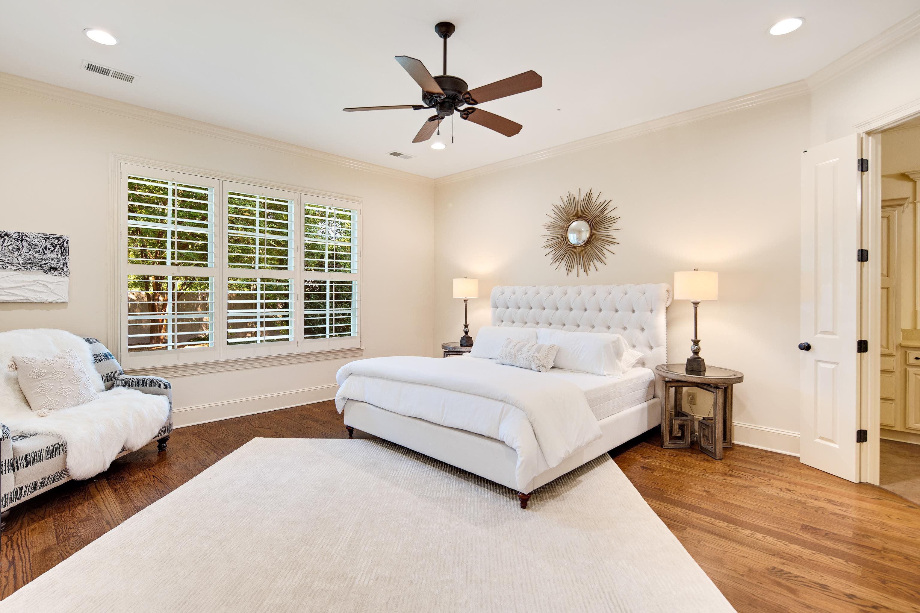 4938 Barfield Road Memphis, TN 38117 - Photo 13 of 40 a spacious bedroom with a bed and a couch