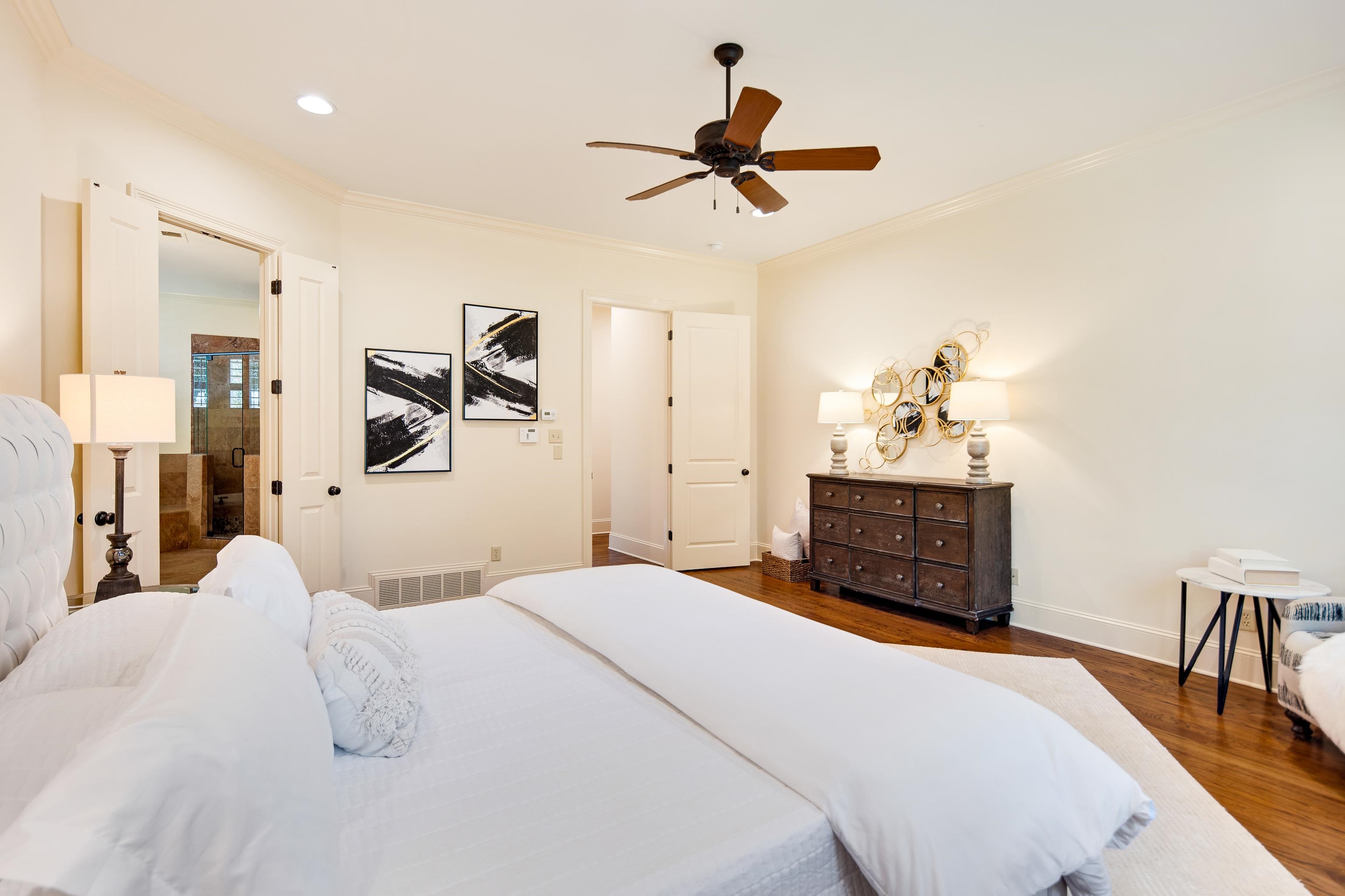 4938 Barfield Road Memphis, TN 38117 - Photo 14 of 40 a bedroom with a bed and a chandelier