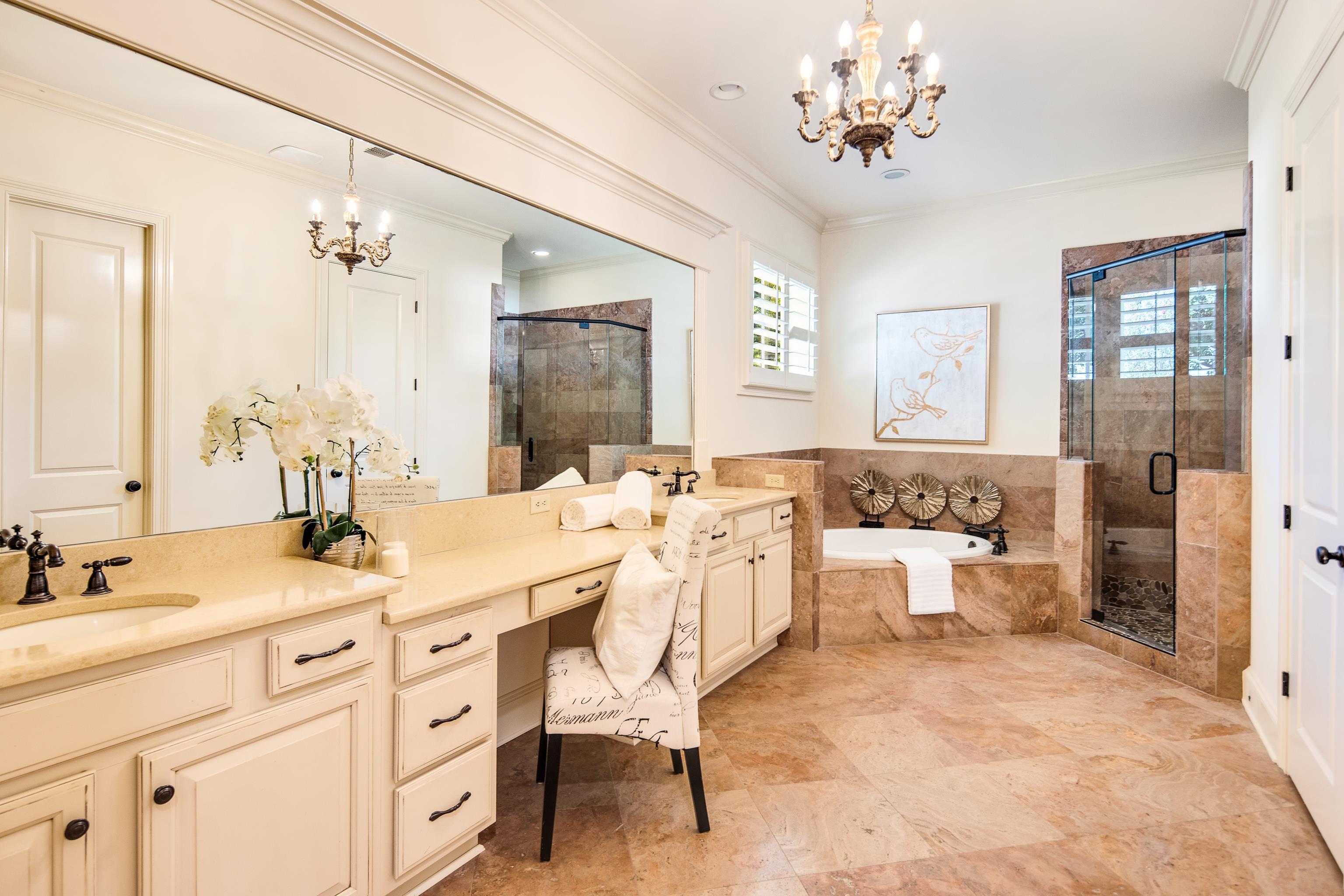 4938 Barfield Road Memphis, TN 38117 - Photo 15 of 40 a spacious bathroom with a double vanity sink mirror and a bathtub