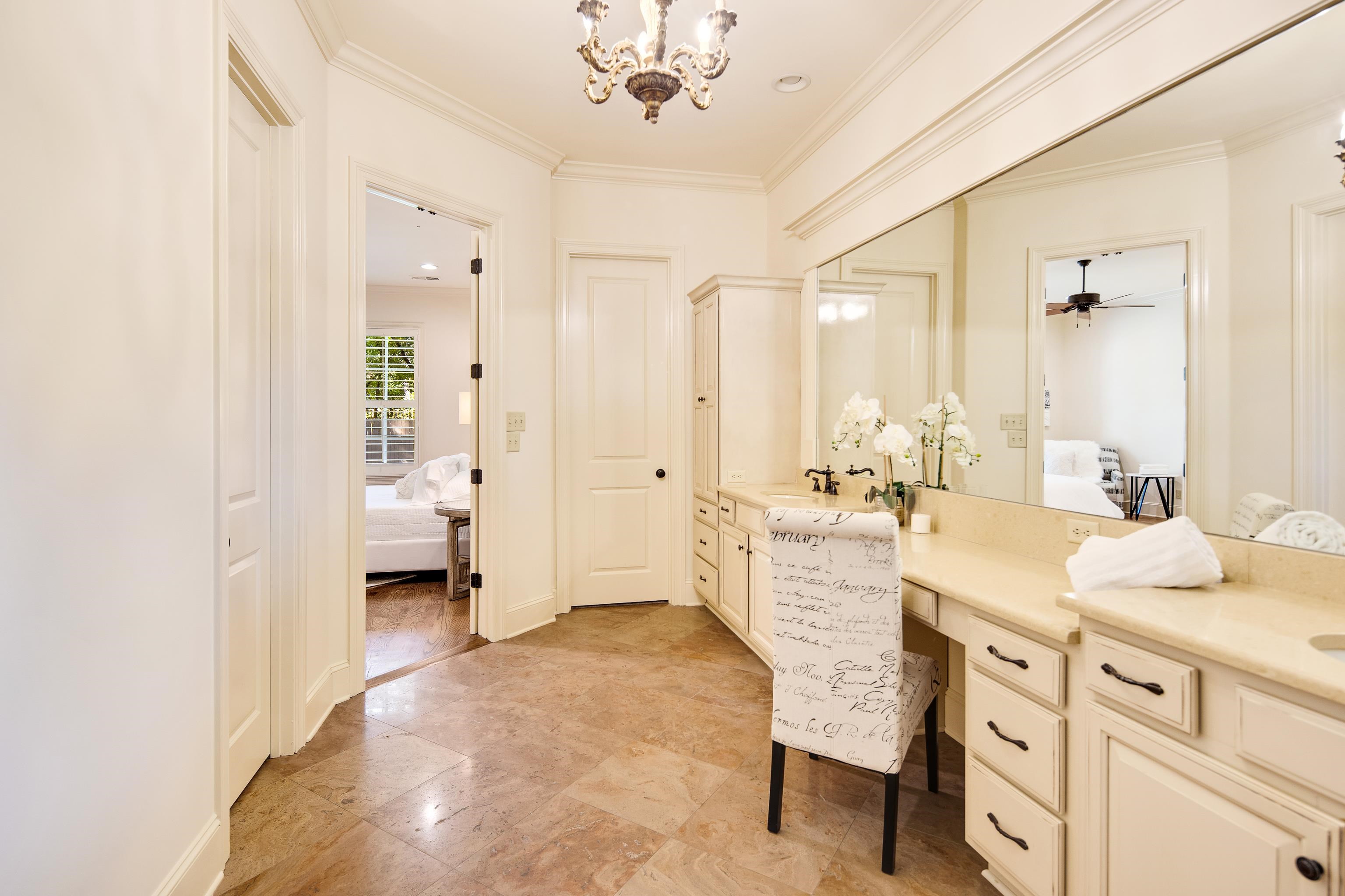 4938 Barfield Road Memphis, TN 38117 - Photo 16 of 40 a large white kitchen with a granite countertop sink and a mirror