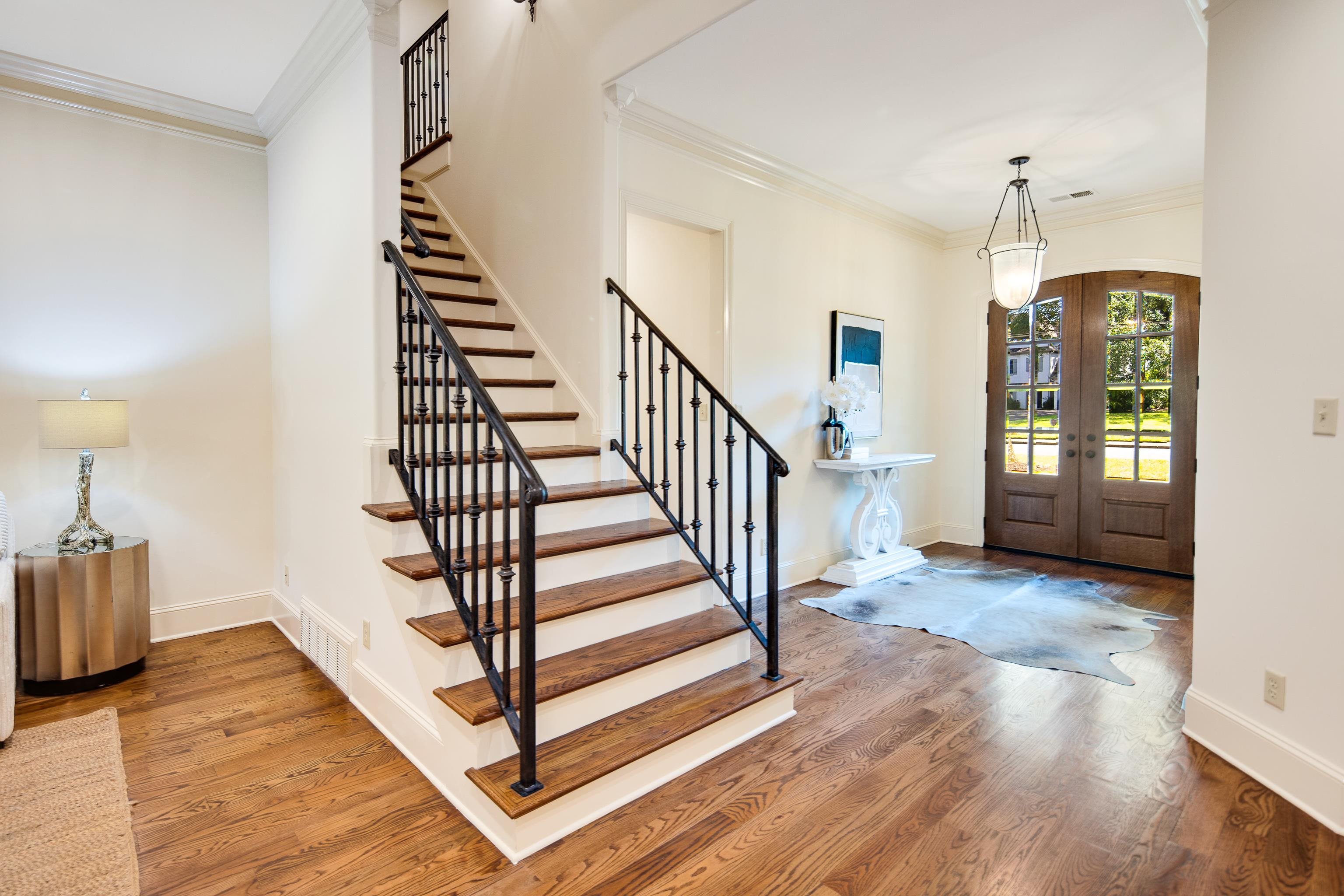 4938 Barfield Road Memphis, TN 38117 - Photo 21 of 40 a view of a hallway with wooden floor and staircase
