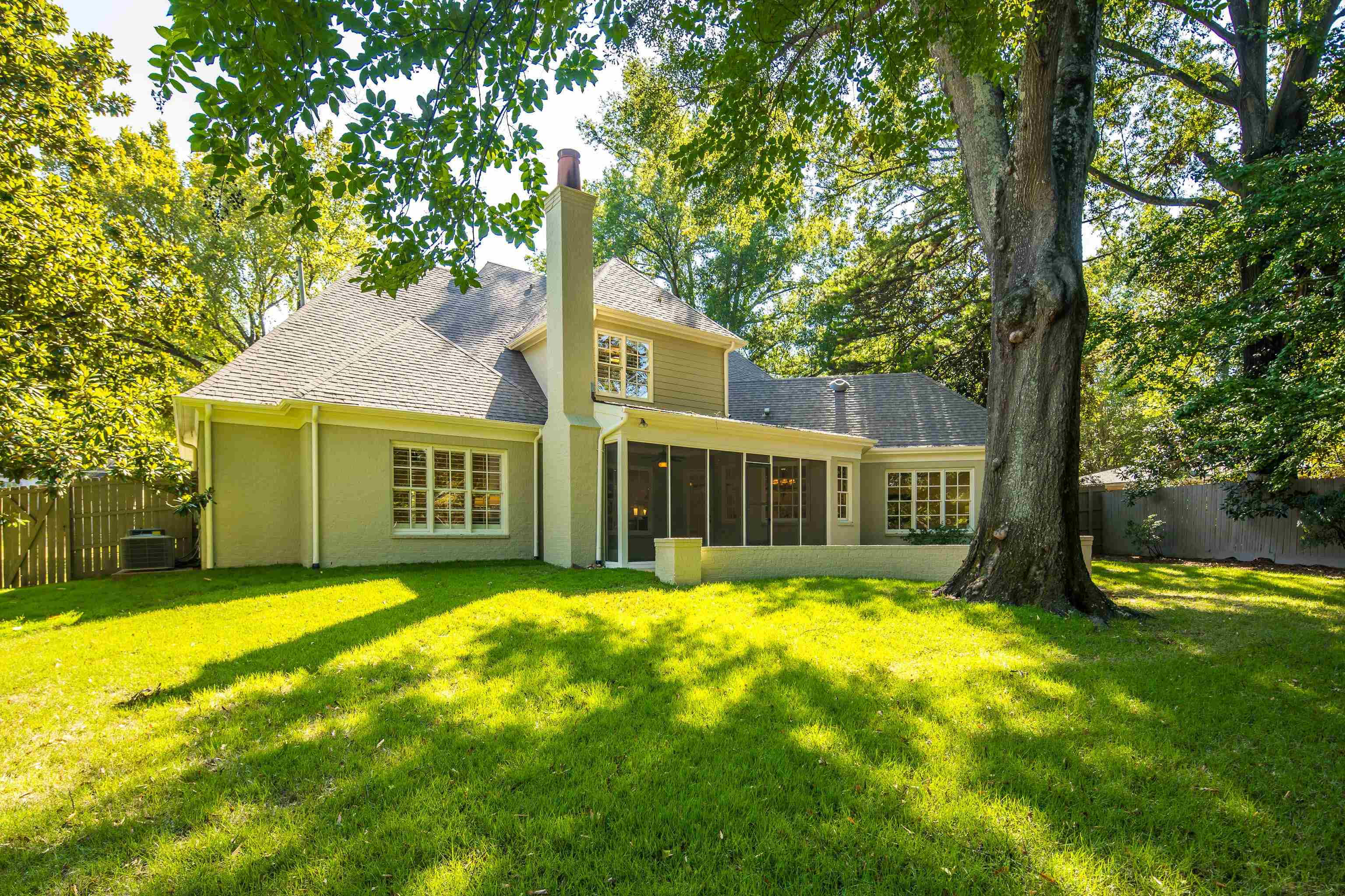 4938 Barfield Road Memphis, TN 38117 - Photo 34 of 40 a view of a house with a yard deck and a large tree