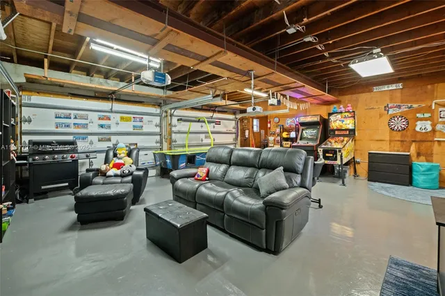 a view of livingroom with furniture and a garage