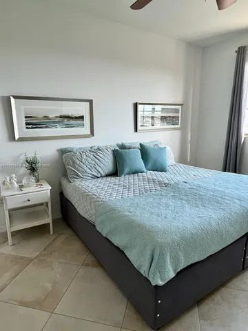 a bedroom with a bed and couch